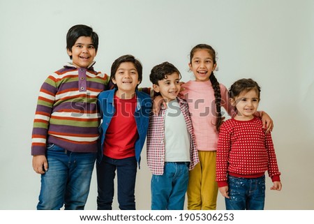 Kids poses in studio in casual wear Royalty-Free Stock Photo #1905306253