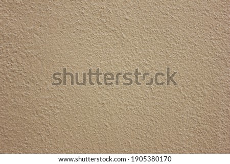 Abstract colorful cement wall rough texture and background ,Yellow - Orange color and high quality picture with copy space for text.