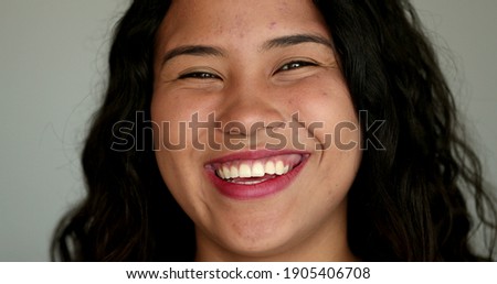 Happy hispanic latina young woman in 20s smiling