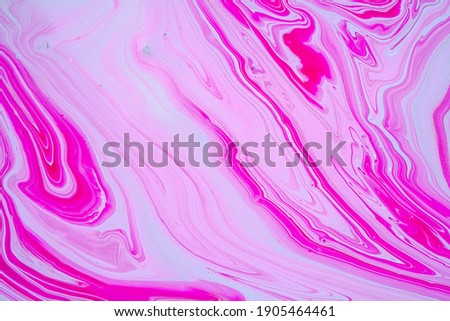 Fluid art texture. Closeup abstract pink, white and grey colors of acrylic for use as background. Liquid acrylic artwork that flows and splashes with marble pattern. Valentines day, love concept. 