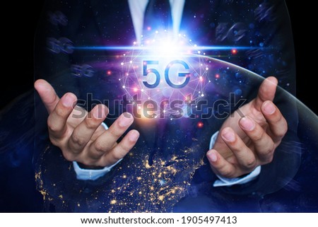 Business people are using innovative technology 5G. Mixed media, digital concepts and connecting the world.element image by nasa