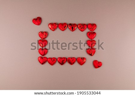 a frame of red hearts on the background for the holiday love of valentine's day february 14