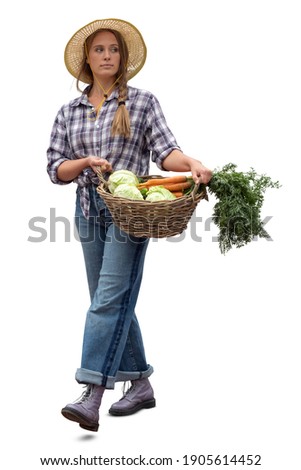 Young woman working at a farm walking and carrying a vegetable basket, isolated on white background Royalty-Free Stock Photo #1905614452