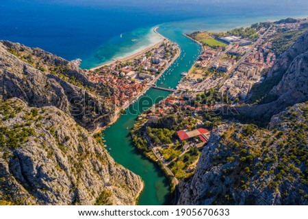 Panorama of town Omis in Croatia - travel background. Aerial drone picture in august 2020 Royalty-Free Stock Photo #1905670633