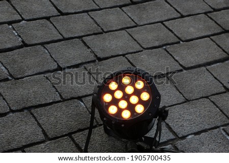 The streetlight illumination lamp on the paving stones