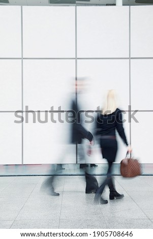 People walking, rush hour, motion blur, shopping center