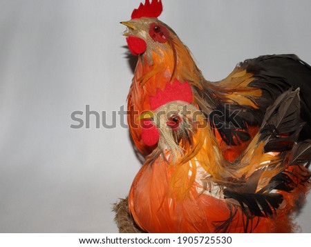orange chicken and rooster with miniature decor