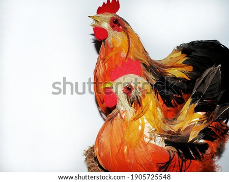 orange chicken and rooster with miniature decor