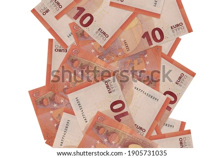 10 euro bills flying down isolated on white. Many banknotes falling with white copyspace on left and right side
