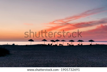 Beach umbrellas at sunrise - Cirali, Antalya Province, Turkey, Asia