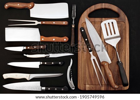 Large Group Of Cookware Isolated On Black Background. Many Knives  and Grilling Tool on Black Table. Collection Of Different Utensils For Cookout Food, Abstract Pattern. Set Of Many Cookware Objects