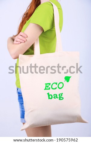 Woman with eco bag, isolated on white