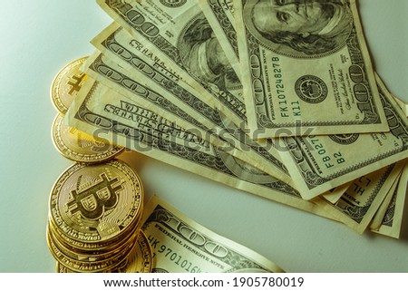 Bitcoin and dollars. The new currency of the future. High quality photo