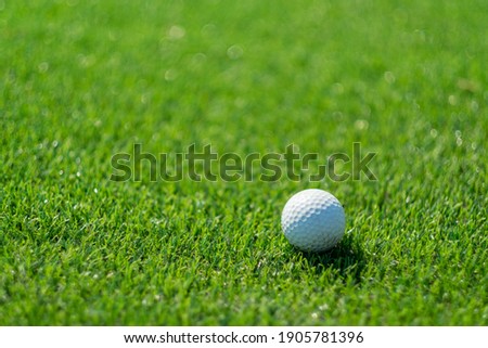 Golf balls on artificial grass with blur background
