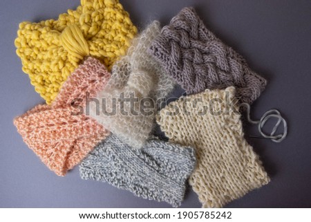 cosy and warm hand knitted headbands for sweater weather with copy space
