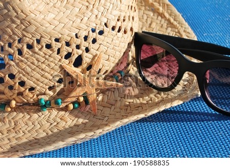 Sun straw hat with beads and decoration starfish and sunglasses vacation holiday stock photo, stock, photograph, image, picture 