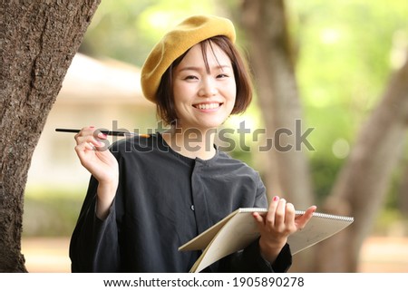 Image of a woman drawing a picture 