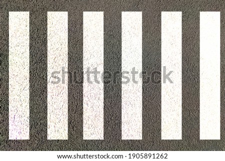 Zebra crossing on road top view used for pedestrians cross walk in urban traffic asphalt highway white and black lines Royalty-Free Stock Photo #1905891262