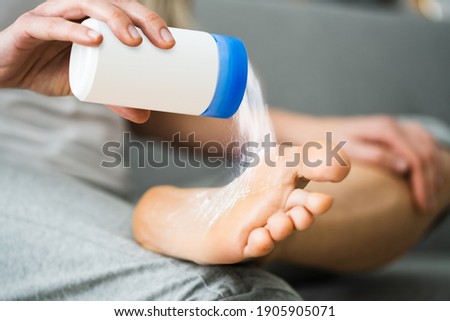 Antifungal Talcum Powder On Foot. Feet Fungus And Talc Royalty-Free Stock Photo #1905905071
