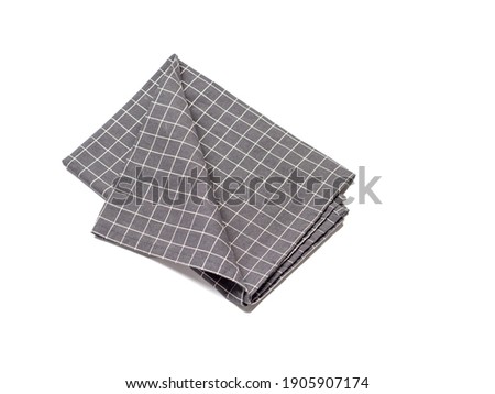 Gray linen napkin isolated on white background.