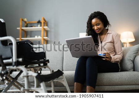 African Woman Shopping Online Using Credit Card
