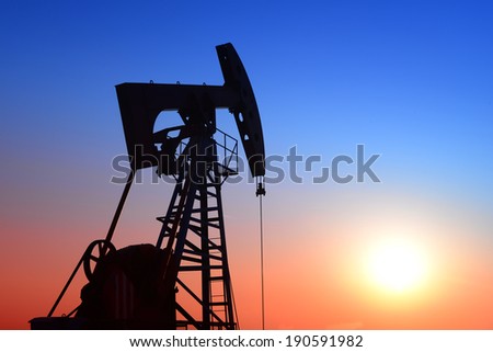An isolated pumping unit in the sunset 