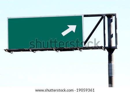 blank freeway sign and blue sky
