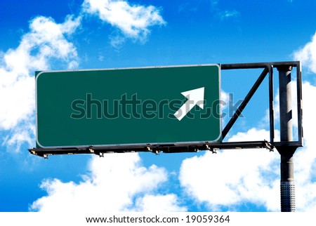 blank freeway sign and cloudy sky