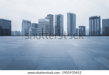 Asphalt ground and urban architectural landscape Royalty-Free Stock Photo #1905970453