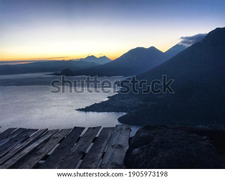 Lake Atitlan, Guatemala - October, 2020: Landscapes of Guatemala. A panoramic view of Lake Atitlan during the sunrise.