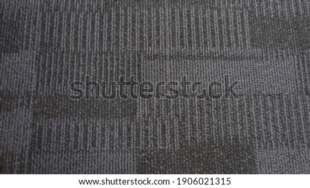 Blue color fabric background. Dark blue carpet pattern interior for the office design