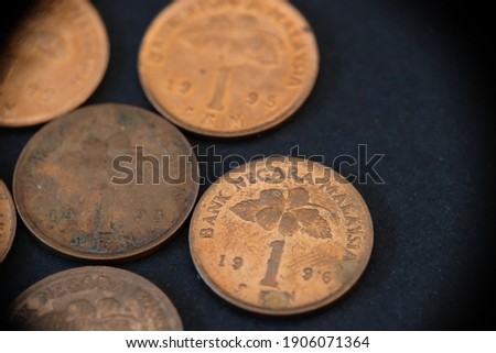 collection old 1 cent or coin, Malaysia currency of Malaysian ringgit coins on black background. Financial and business concept