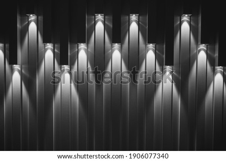 Spotlights on the wall and downward beams - wall backdrop with spot lighting - theater curtain