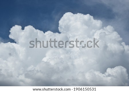 some pictoresque white clouds in the blue sky Royalty-Free Stock Photo #1906150531