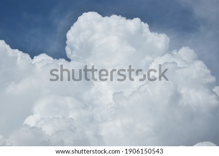 some pictoresque white clouds in the blue sky Royalty-Free Stock Photo #1906150543