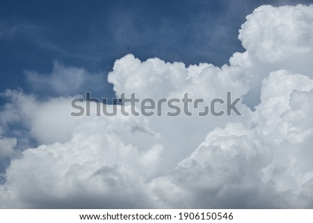 some pictoresque white clouds in the blue sky Royalty-Free Stock Photo #1906150546
