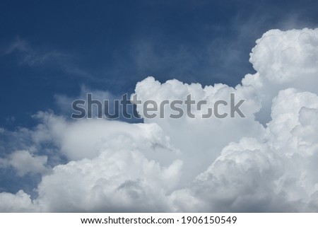 some pictoresque white clouds in the blue sky Royalty-Free Stock Photo #1906150549