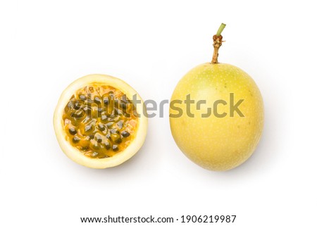 Flat lay of Yellow passion fruit with cut in half  isolated on white background. Clipping path. Royalty-Free Stock Photo #1906219987