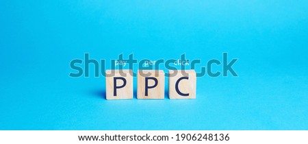 Wooden blocks with the word PPC. Internet advertising model used to drive traffic to websites. Internet marketing concept, social media marketing. Search engine optimization. Pay-per-click Royalty-Free Stock Photo #1906248136