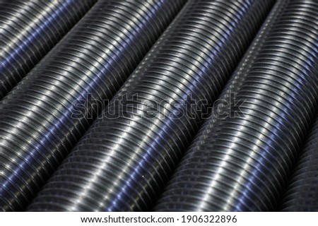 Large-diameter industrial steel bolts without heads, used in the assembly of structures in mechanical engineering, in the warehouse of finished products in large quantities Royalty-Free Stock Photo #1906322896