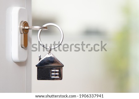 house key in the door Royalty-Free Stock Photo #1906337941