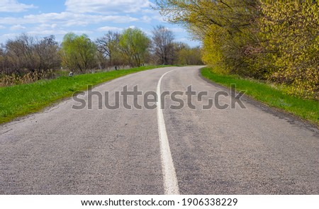 asphalt rural road turn, summer outdoor background