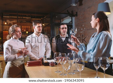 The restaurant staff learns to distinguish between glasses Royalty-Free Stock Photo #1906343095