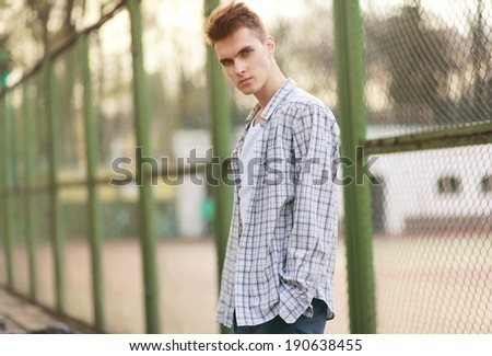 Handsome man model with deep look in urban style, street fashion