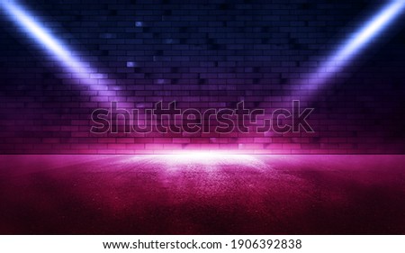 Neon scene empty with smoke and spotlight on brick wall.