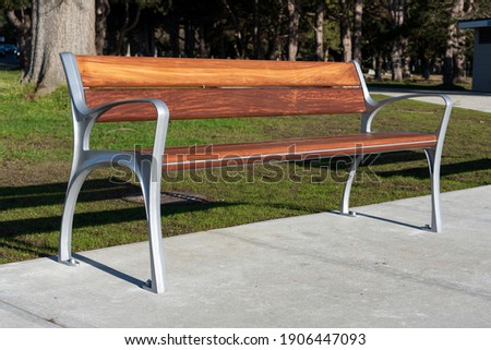 A modern bench in a park