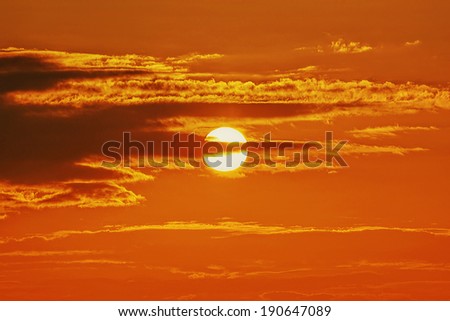 Sun at sunrise / sunset with clouds