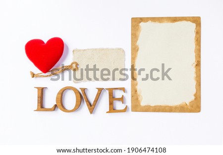 Valentine card background idea, love wooden font with red heart and blank paper card on white background, love and romance concept