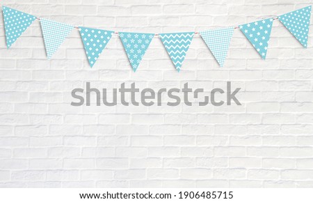 Blue party flags hanging on white wall background, birthday, anniversary, celebration event, festival greeting card background