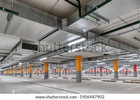 Large underground parking. The interior of the underground parking lot.